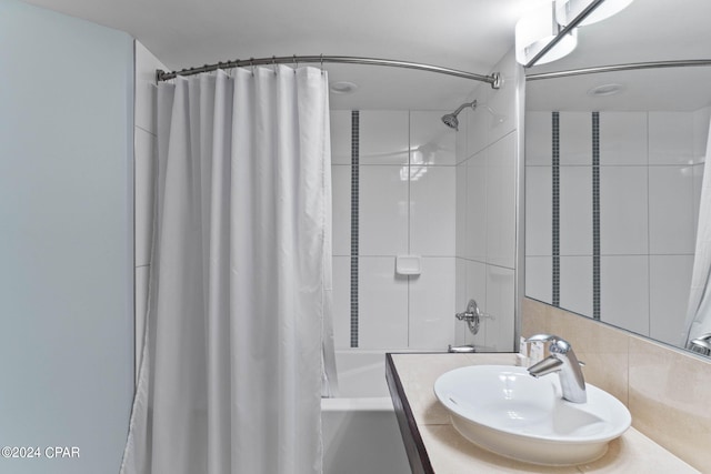 bathroom featuring vanity and shower / tub combo