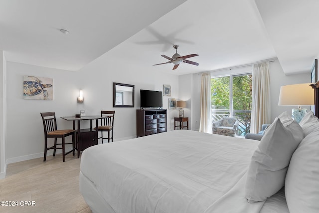 bedroom with light hardwood / wood-style floors and ceiling fan