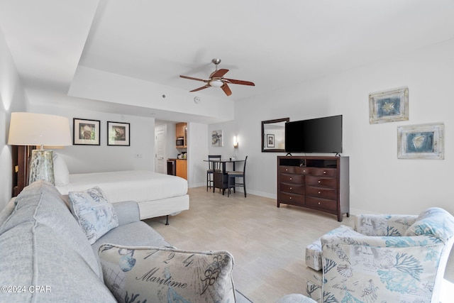 living room with light tile patterned floors and ceiling fan