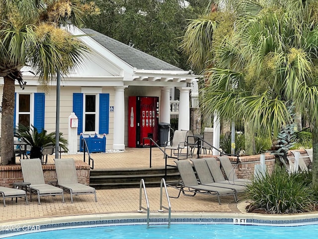 view of swimming pool featuring a patio