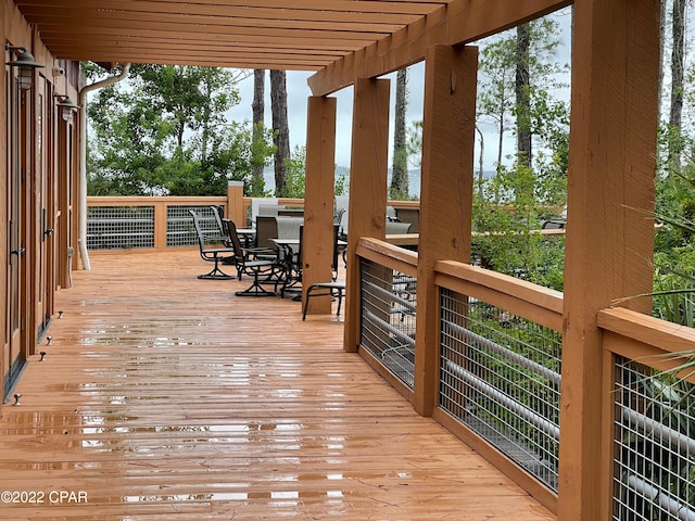 wooden terrace with a pergola