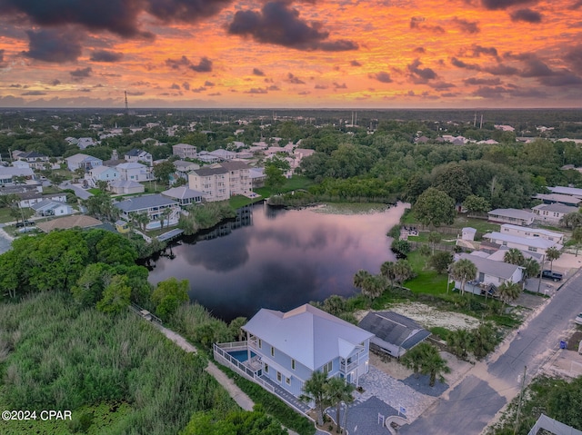 aerial view at dusk with a water view