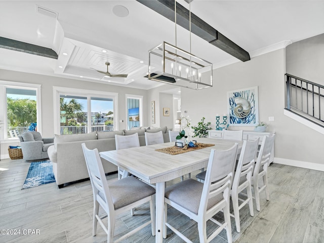 dining area featuring coffered ceiling, ceiling fan with notable chandelier, light hardwood / wood-style flooring, ornamental molding, and beam ceiling