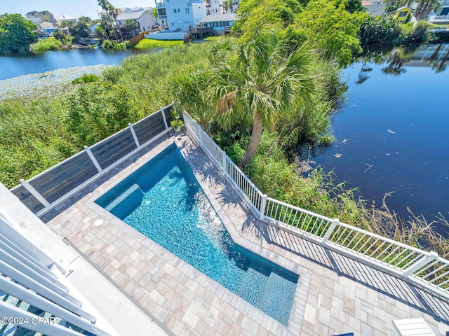 view of pool with a water view