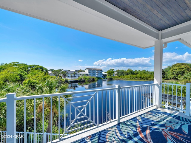 balcony featuring a water view