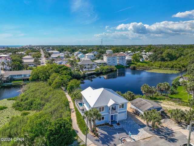 birds eye view of property with a water view