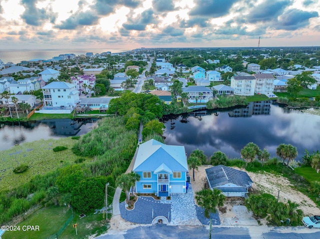 aerial view at dusk with a water view