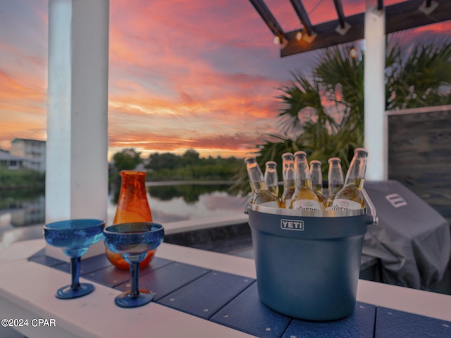 patio terrace at dusk with a water view