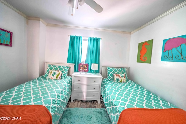 bedroom featuring crown molding, ceiling fan, and dark wood-type flooring