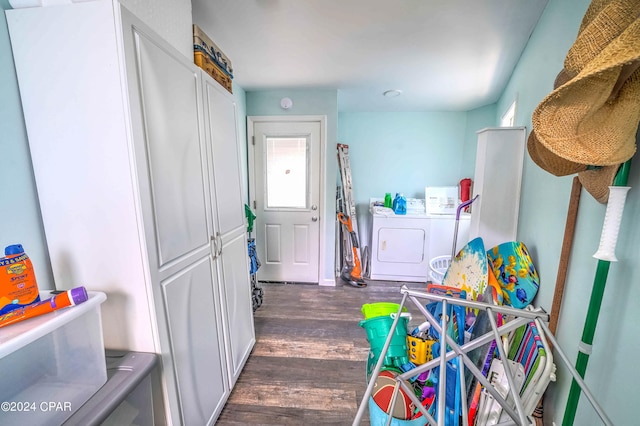 interior space featuring independent washer and dryer and dark hardwood / wood-style floors