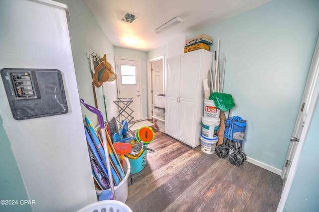 game room featuring dark wood-type flooring