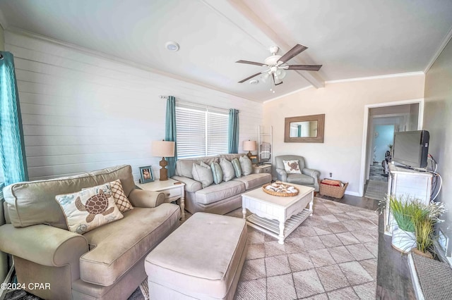 living room with ceiling fan, lofted ceiling with beams, light hardwood / wood-style flooring, and crown molding