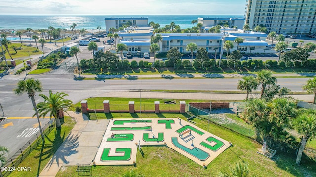 birds eye view of property with a water view