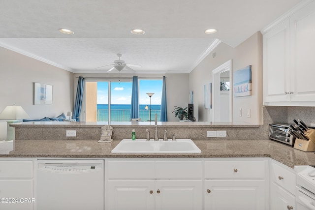 kitchen featuring white cabinetry, ceiling fan, sink, a water view, and white dishwasher