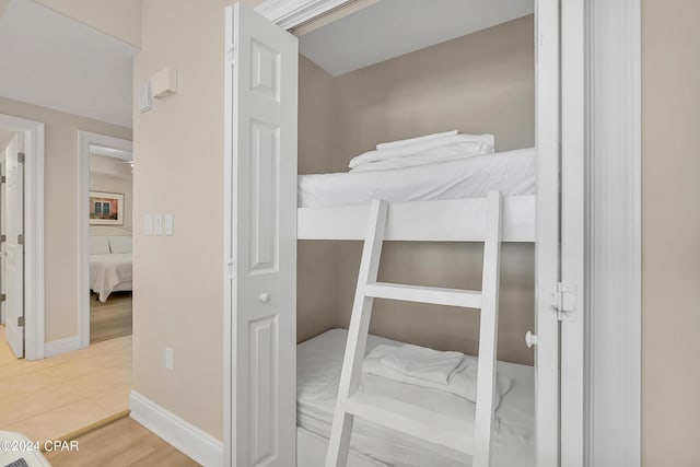 bedroom with hardwood / wood-style flooring