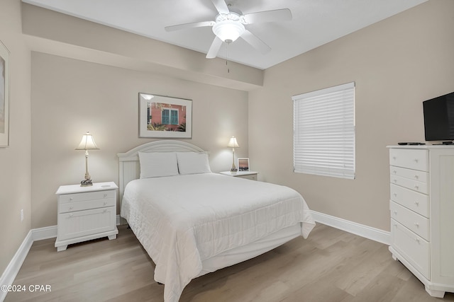 bedroom with ceiling fan and light hardwood / wood-style flooring