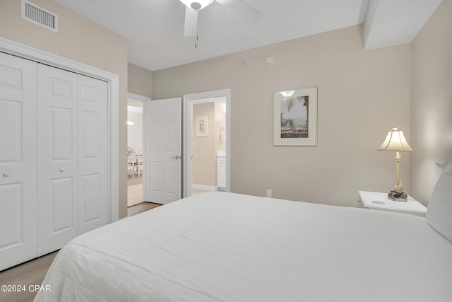 bedroom featuring ceiling fan, a closet, and light hardwood / wood-style flooring