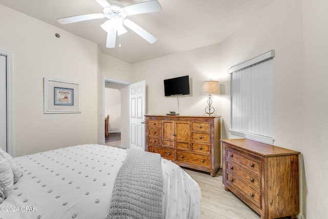 bedroom with ceiling fan and light hardwood / wood-style flooring