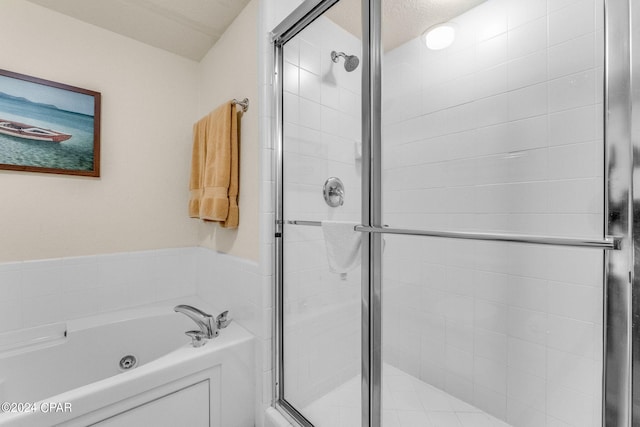 bathroom with shower with separate bathtub