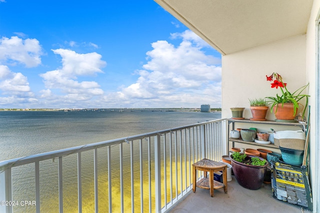 balcony featuring a water view