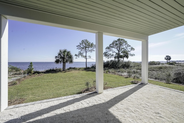 view of patio with a water view