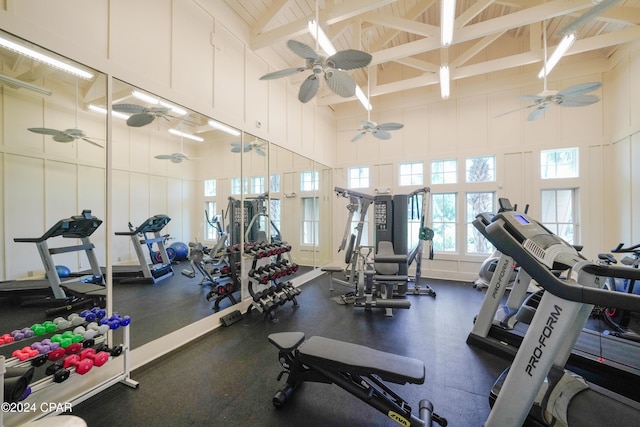 workout area featuring high vaulted ceiling and wooden ceiling