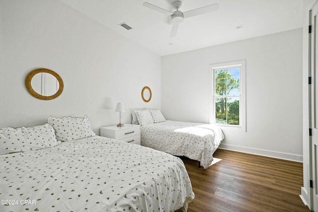 bedroom featuring ceiling fan and dark wood-type flooring