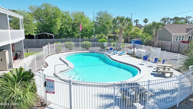 view of swimming pool featuring a patio area