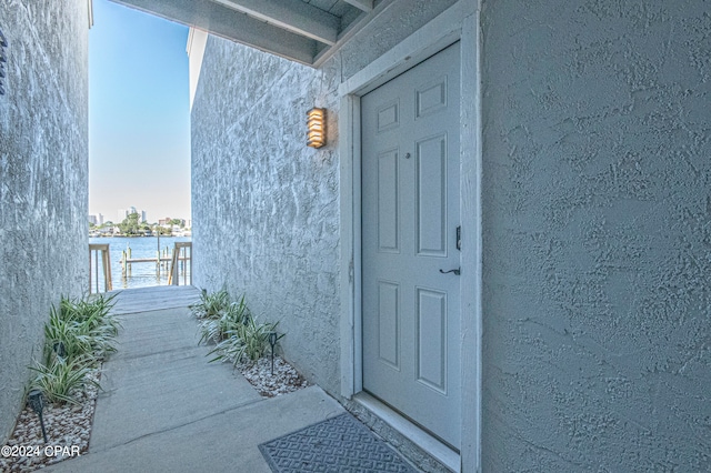 entrance to property featuring a water view