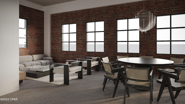 dining room featuring brick wall