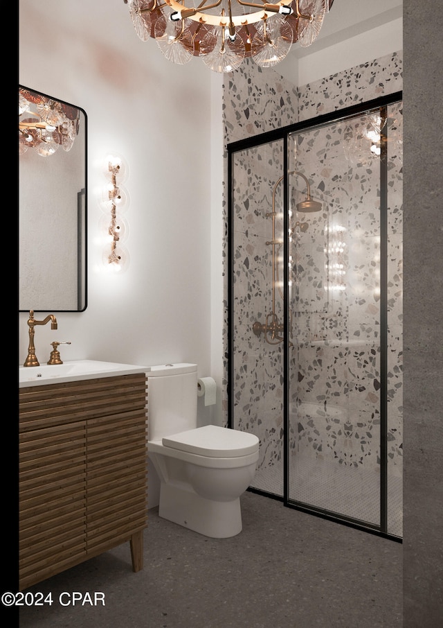 bathroom with vanity, toilet, a shower with shower door, and an inviting chandelier