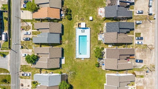 birds eye view of property with a residential view