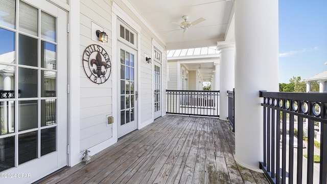 wooden terrace featuring ceiling fan and covered porch