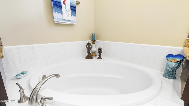 bathroom with tiled bath