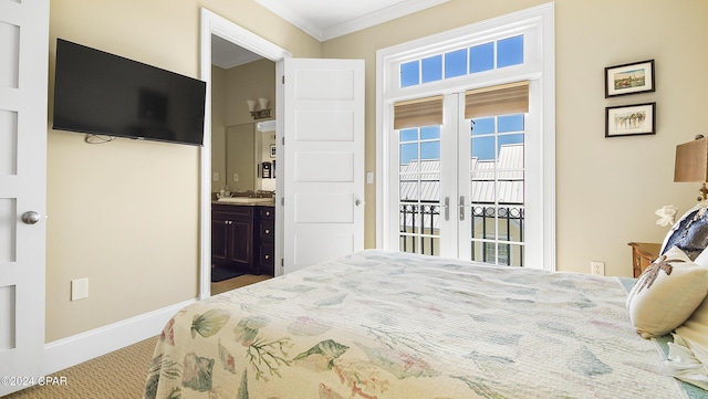 carpeted bedroom featuring french doors, access to outside, crown molding, and ensuite bathroom