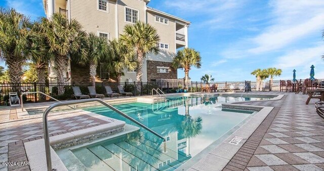 view of swimming pool featuring a patio