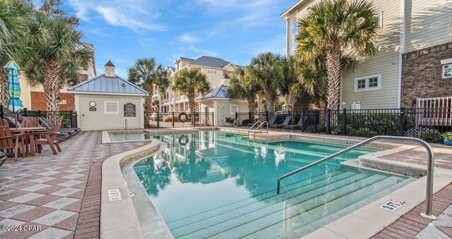 view of swimming pool with a patio