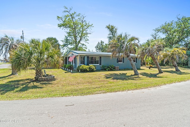 ranch-style home with a front yard