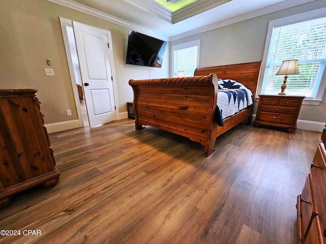 bedroom featuring dark hardwood / wood-style floors and ornamental molding