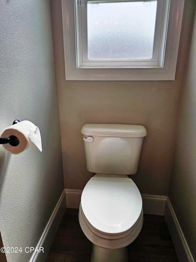 bathroom featuring toilet and hardwood / wood-style flooring