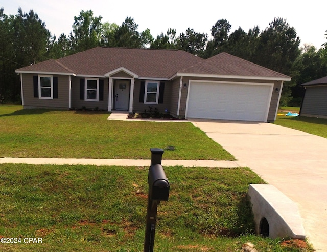 ranch-style home with a front lawn and a garage