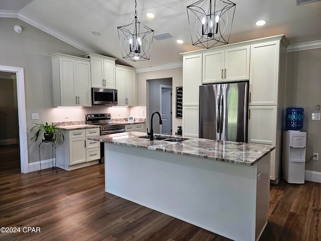 kitchen with dark wood-type flooring, hanging light fixtures, and stainless steel appliances