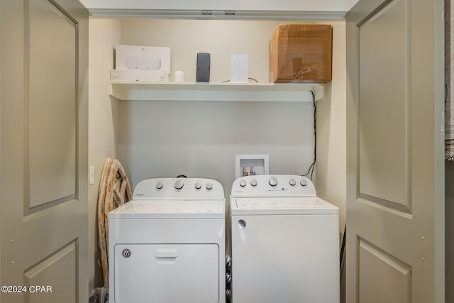 clothes washing area with independent washer and dryer