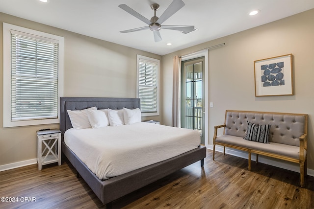 bedroom with ceiling fan and dark hardwood / wood-style floors