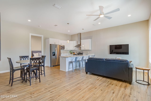 interior space featuring light hardwood / wood-style flooring and ceiling fan