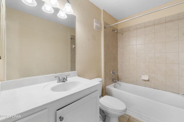 full bathroom with tile patterned flooring, vanity, toilet, and tiled shower / bath