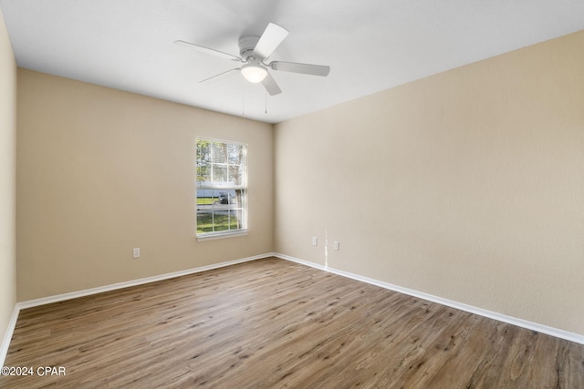 unfurnished room featuring ceiling fan and wood-type flooring