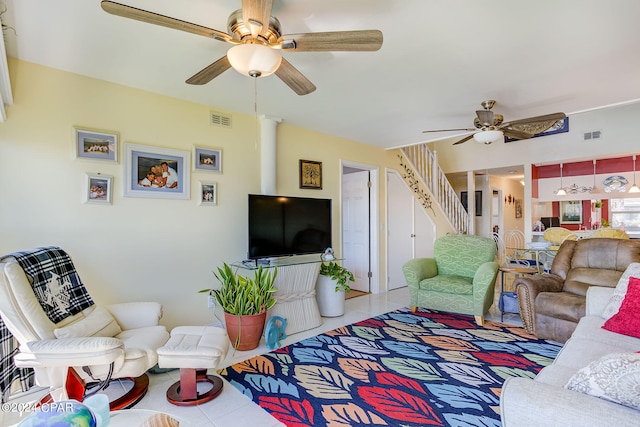 living room featuring ceiling fan and light tile floors