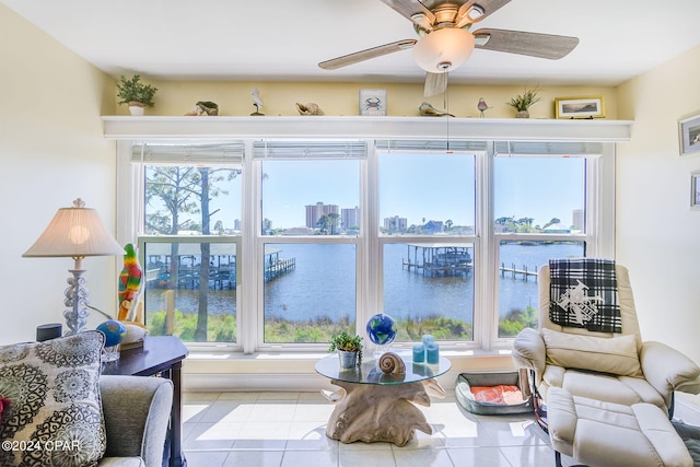 interior space featuring a water view and ceiling fan