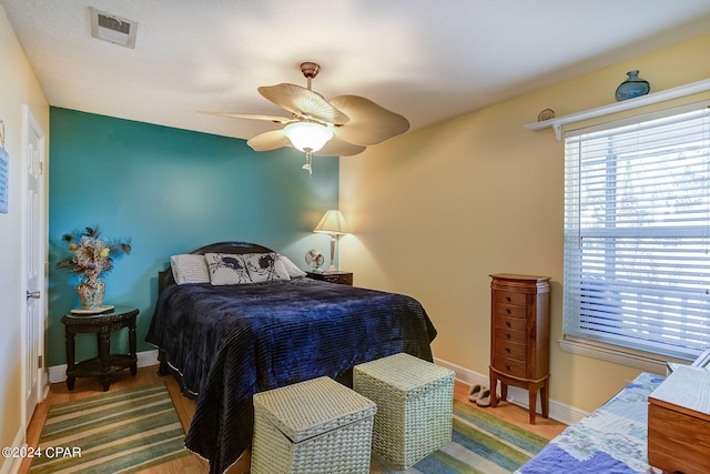 bedroom featuring ceiling fan and hardwood / wood-style floors